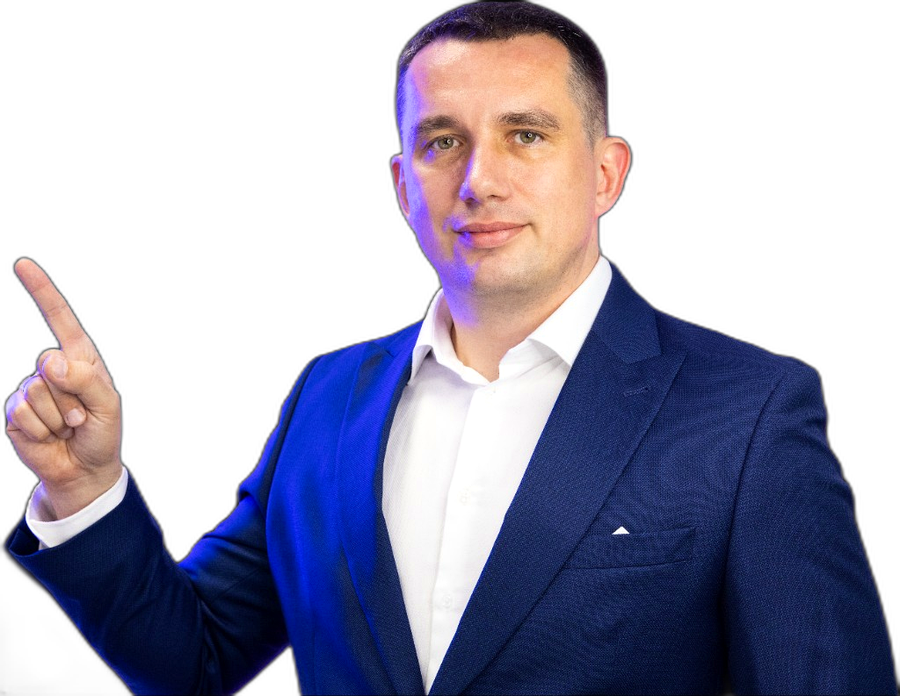 Doradca Droptica w granatowym garniturze wskazujący w górę